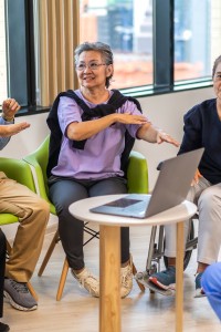 Portrait of asian woman physiotherapist trainer carer help physical and discussing consulting with group asian senior patient by doing yoga workout exercises in rehabilitation at hospital.healthcare